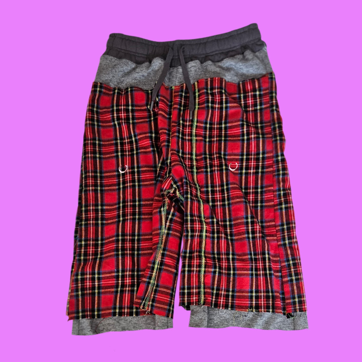 Red pierced baggy shorts.