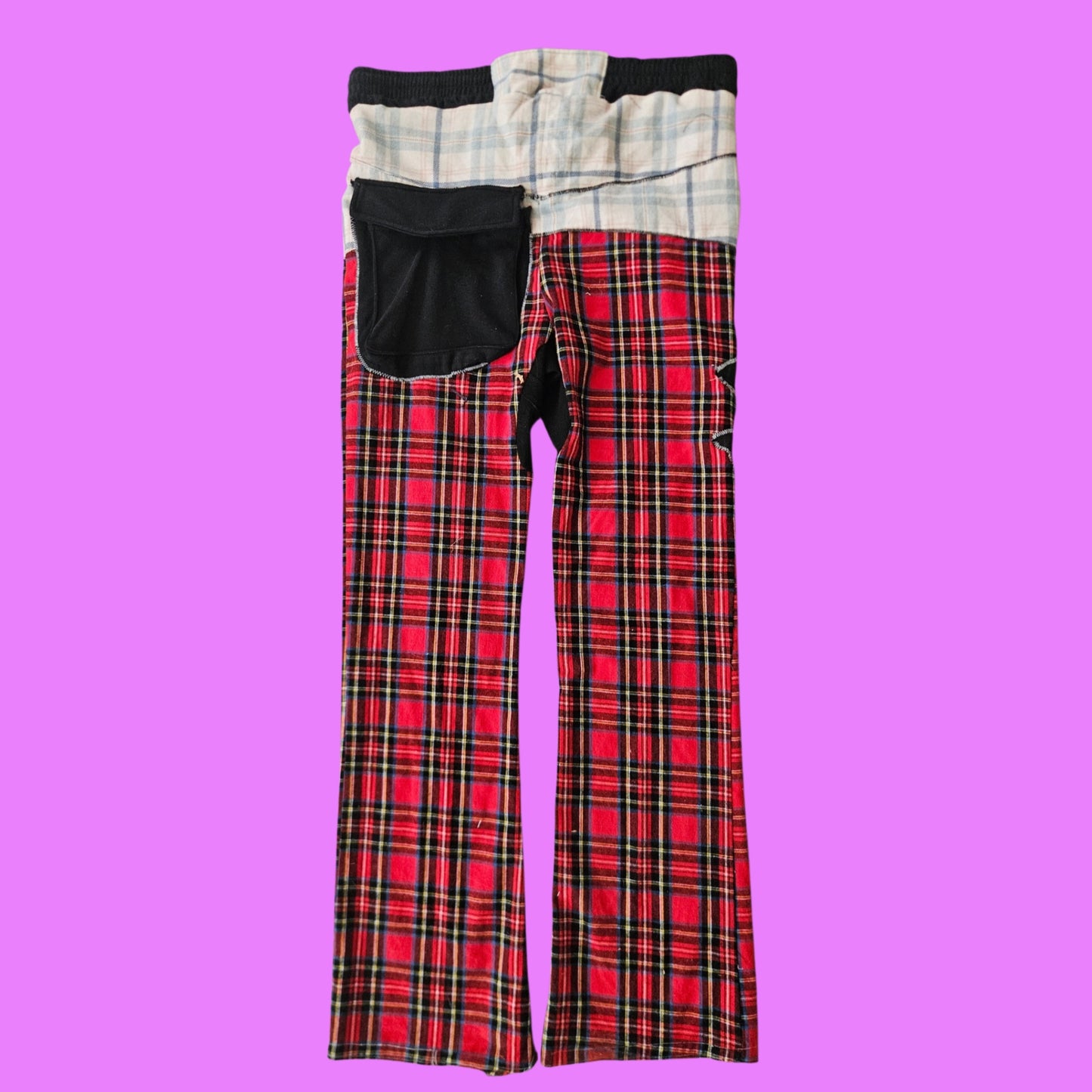 Hybrid plaid skull patch pants.