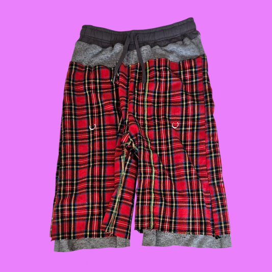 Red pierced baggy shorts.